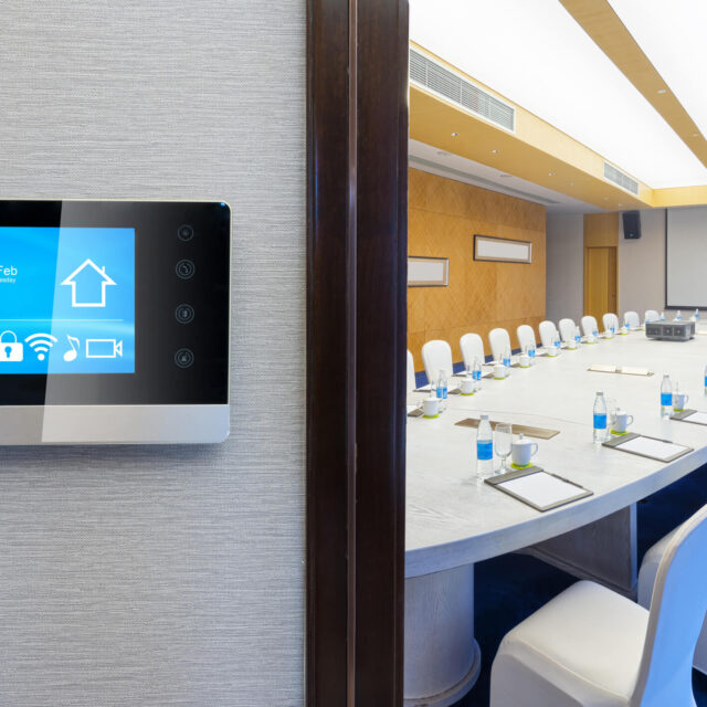 https://aicorpinc.ai/wp-content/uploads/2023/12/meeting-room-with-smart-thermostat-showing-hotel-automation-640x640.jpg